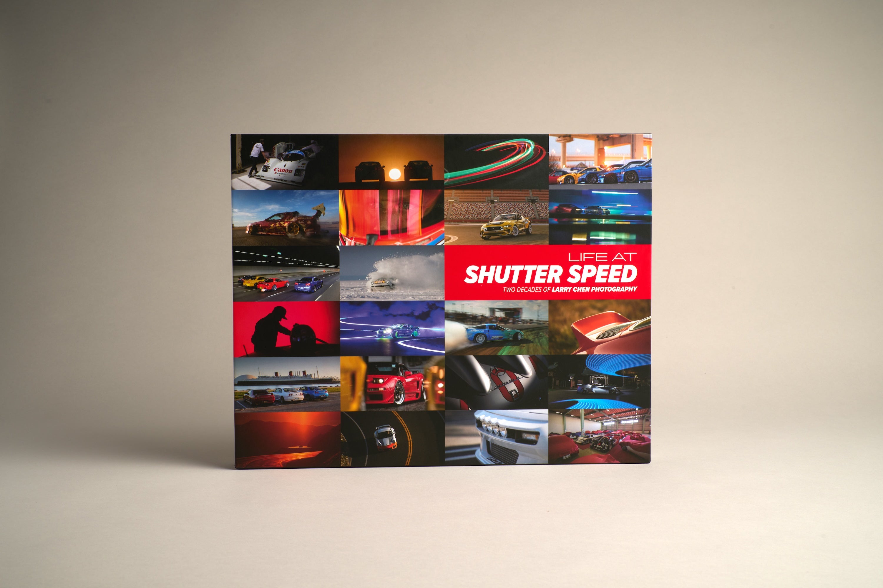 Studio photo of the Larry Chen book Life At Shutter Speed, a 400-page collector's item in hardcover photobook 14x11 format. The perfect coffee table book for auto enthusiasts featuring JDM, drifting, motorsports and car culture. Published by Carrara Media. Available now.