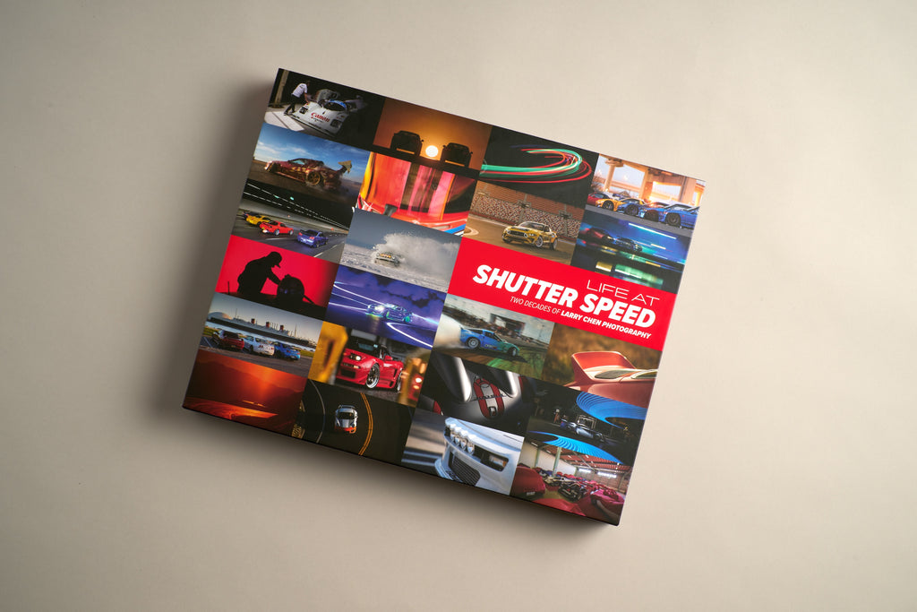 Studio photo of the Larry Chen book Life At Shutter Speed, a 400-page collector's item in hardcover photobook 14x11 format. The perfect coffee table book for auto enthusiasts featuring JDM, drifting, motorsports and car culture. Published by Carrara Media. Available now.