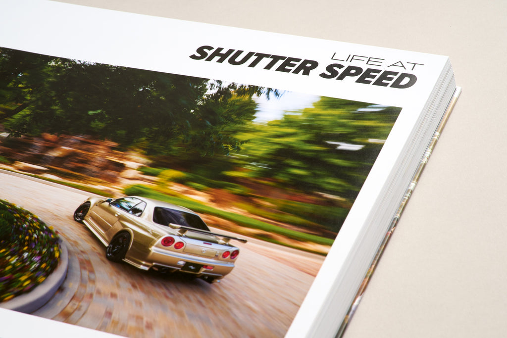 Studio photo of the Larry Chen book Life At Shutter Speed, a 400-page collector's item in hardcover photobook 14x11 format. The perfect coffee table book for auto enthusiasts featuring JDM, drifting, motorsports and car culture. Published by Carrara Media. Available now.
