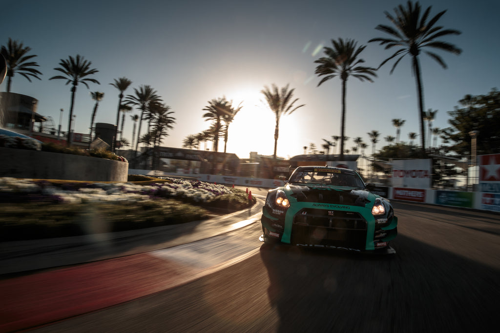 Image of Nissan GT-R racecar competing at Grand Prix of Long Beach, photo by Larry Chen. From the 400-page coffee table book Life At Shutter Speed by Larry Chen, foreword by Jeff Zwart and afterword by Magnus Walker. Published by Carrara Media.