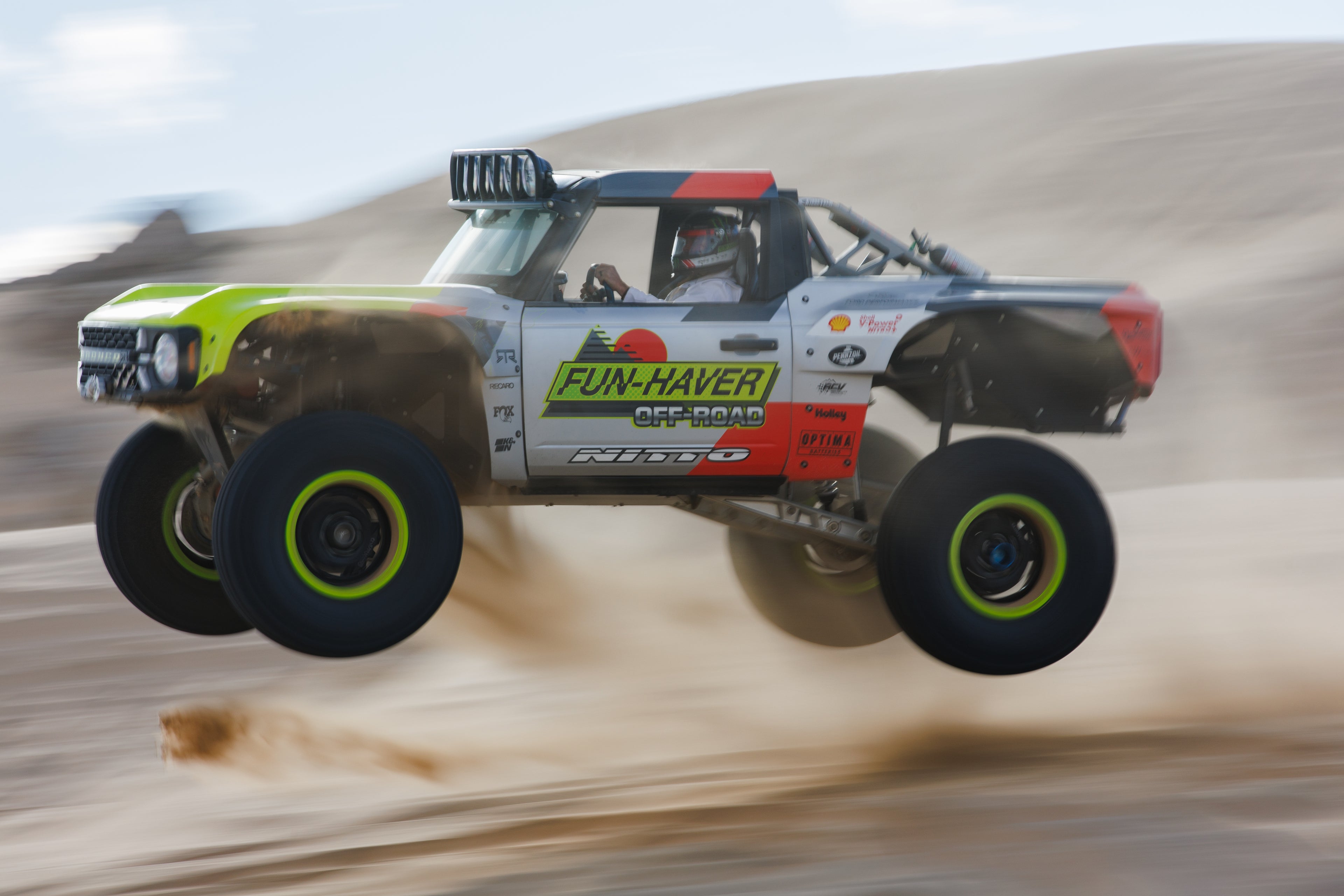Image of Vaughn Gittin Jr. driving El Bandito as it jumps an off-road sand dune, photo by Larry Chen. From the new book Ready To Rock by Vaughn Gittin Jr. with Mike Spinelli, foreword by T-Pain, published by Carrara Media. The story of RTR Vehicles and professional drifting, off-road racing and the Ford RTR Mustang and RTR Bronco.